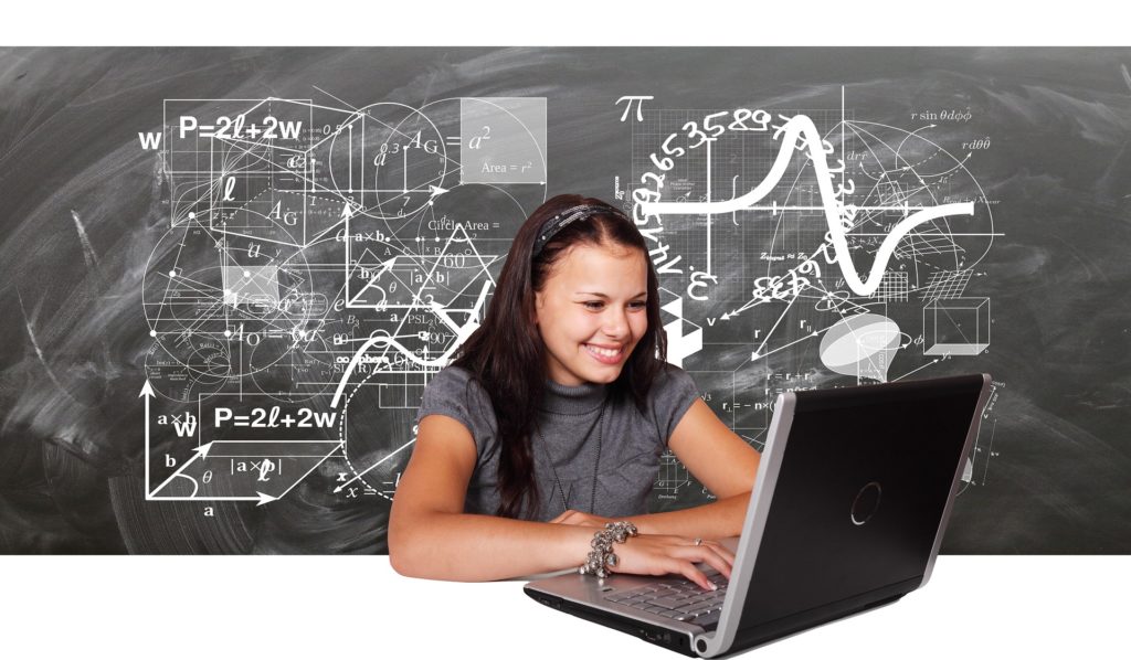 happy student accessing any site she wants on a laptop with a VPN connection